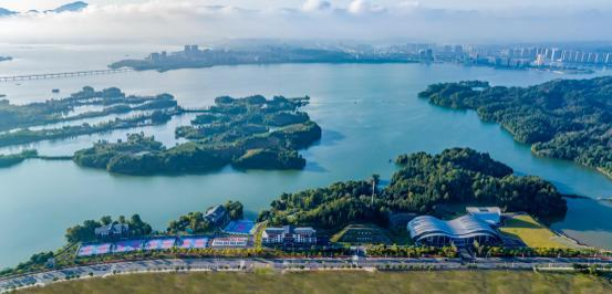Aerial view of a lakeside tennis center built by CourtNova's founder in China